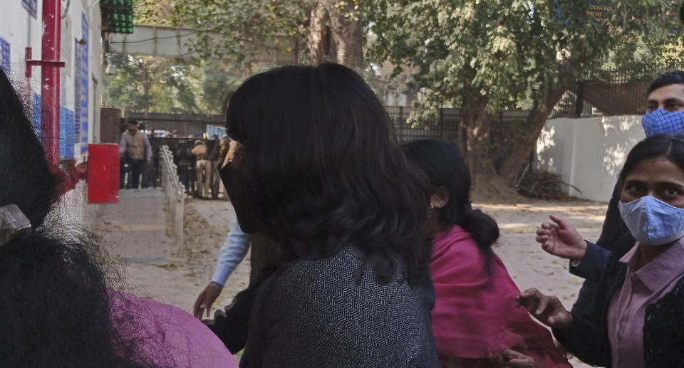 Climate activist Disha Ravi, 22, walks towards a court in New Delhi, India, Friday, Feb. 19, 2021. An Indian court on Friday sent the activist to judicial custody for three days. Ravi was arrested for circulating a document on social media supporting months of massive protests by farmers in India. Her arrest marks the latest example of a crackdown on dissent under Prime Minister Narendra Modi’s government, critics say. (AP Photo/Dinesh Joshi)