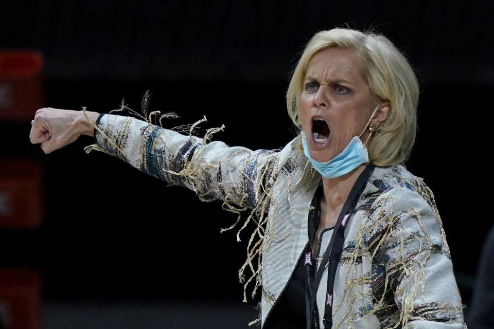 Baylor head coach Kim Mulkey talks to her team during the first half of an NCAA college basketball game against West Virginia in the final round of the Big 12 Conference tournament in Kansas City, Mo, Sunday, March 14, 2021. (AP Photo/Charlie Riedel)