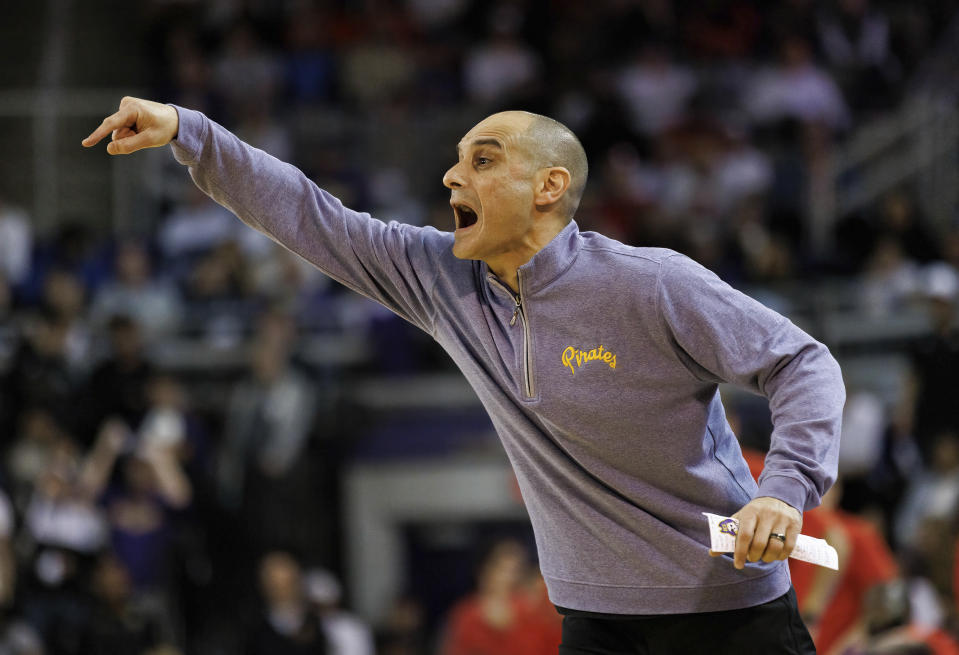 East Carolina head coach Michael Schwartz shouts toward the court during the first half of an NCAA college basketball game against Houston in Greenville, N.C., Saturday, Feb. 25, 2023. (AP Photo/Ben McKeown)