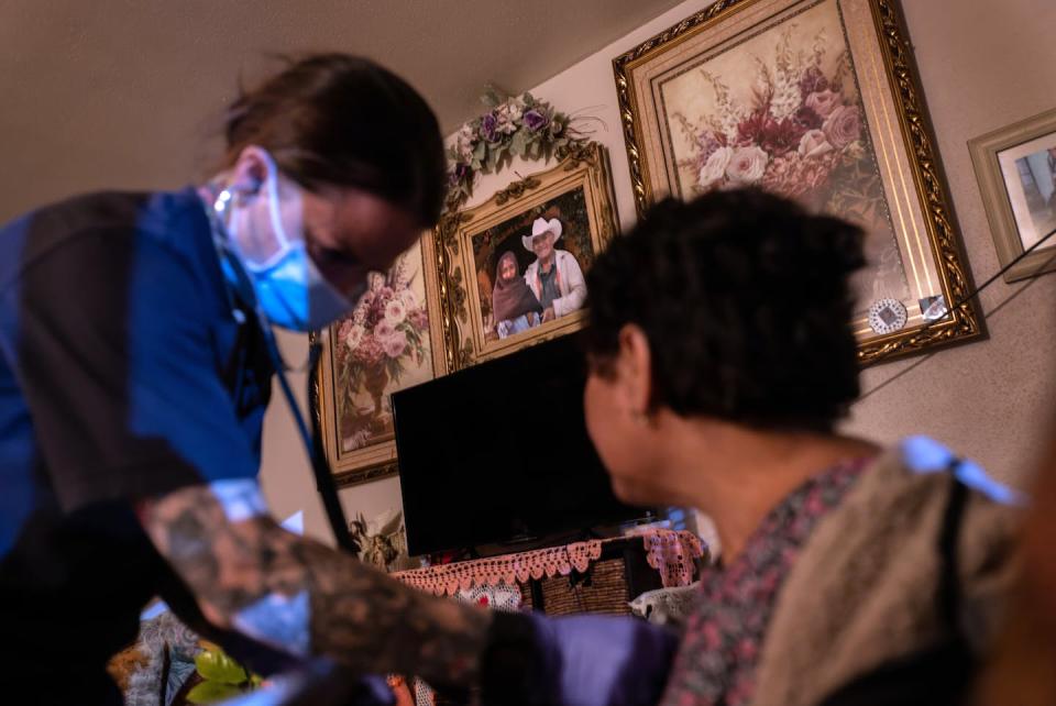 A medic from Houston EMS takes the blood pressure of a Mexican immigrant with possible COVID-19 symptoms. <a href="https://www.gettyimages.com/detail/news-photo/medic-from-the-houston-fire-department-ems-takes-the-blood-news-photo/1334885143" rel="nofollow noopener" target="_blank" data-ylk="slk:John Moore via Getty Images;elm:context_link;itc:0;sec:content-canvas" class="link ">John Moore via Getty Images</a>