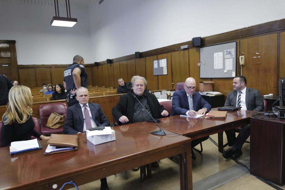 Steve Bannon, center, appears in Manhattan Supreme Court with his lawyers Susan Carman left, John Carman, second from left, Harlan Protass, second from right, and Joshua Kirshner, Tuesday, Feb. 28, 2023 in New York. Bannon is accused of fraud in connection with a charity raising money for a wall on the southern U.S. border. (AP Photo/Curtis Means/DailyMail via AP, Pool)