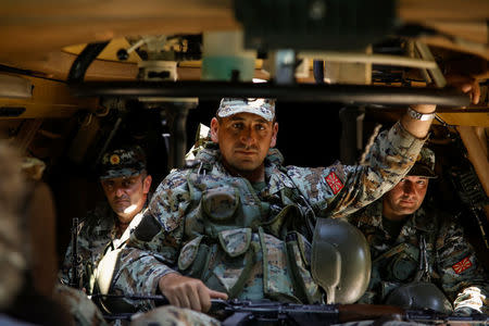 Macedonian soldiers patrol at the Macedonia-Greece border near Gevgelija, Macedonia, June 3, 2018. REUTERS/Marko Djurica