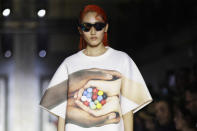 A model wears a creation as part of the Benetton Spring-Summer 2020 collection, unveiled during the fashion week, in Milan, Italy, Tuesday, Sept. 17, 2019. (AP Photo/Luca Bruno)