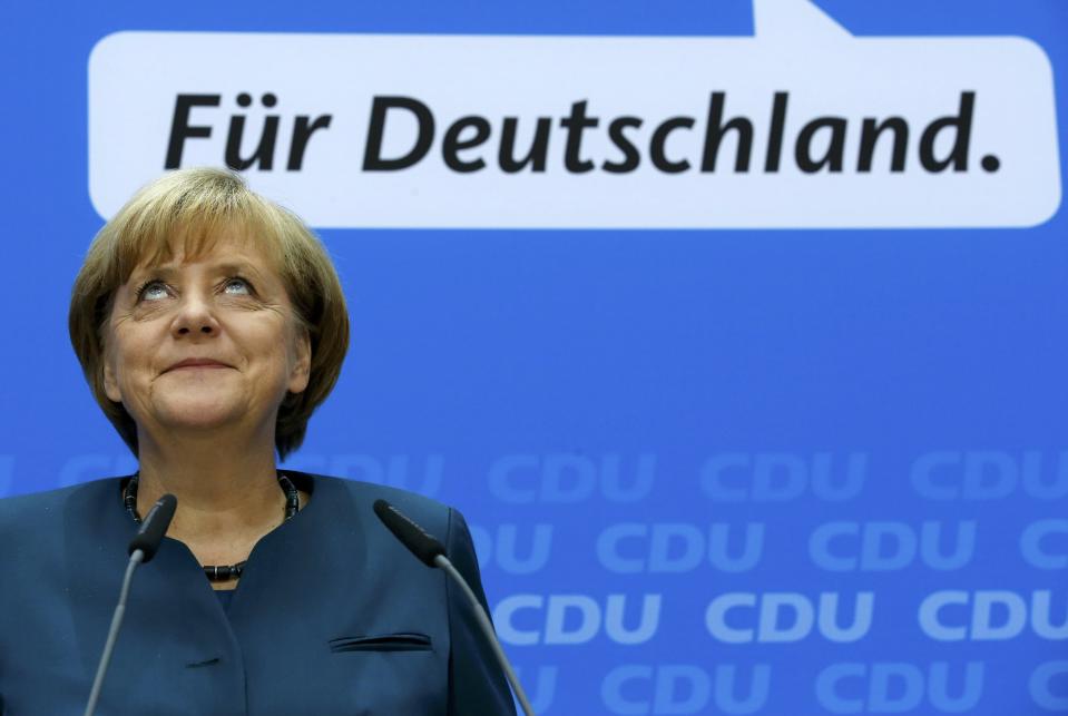 German Chancellor Merkel smiles during news conference after CDU party board meeting in Berlin