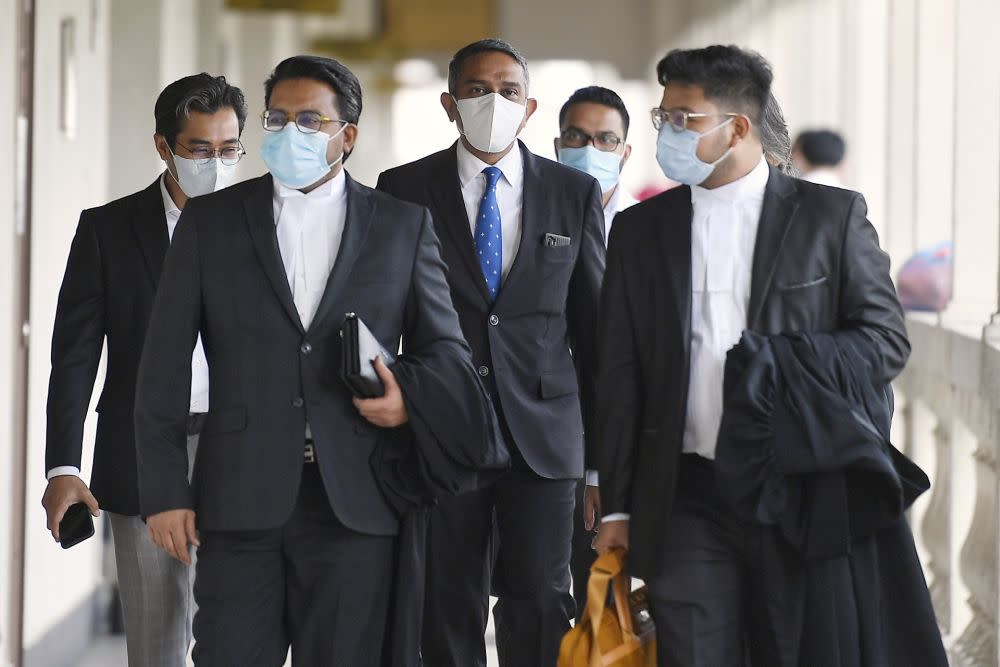 Lawyer Datuk Mohd Hafarizam Harun (centre) is pictured at the Kuala Lumpur High Court August 3, 2020. — Picture by Ahmad Zamzahuri