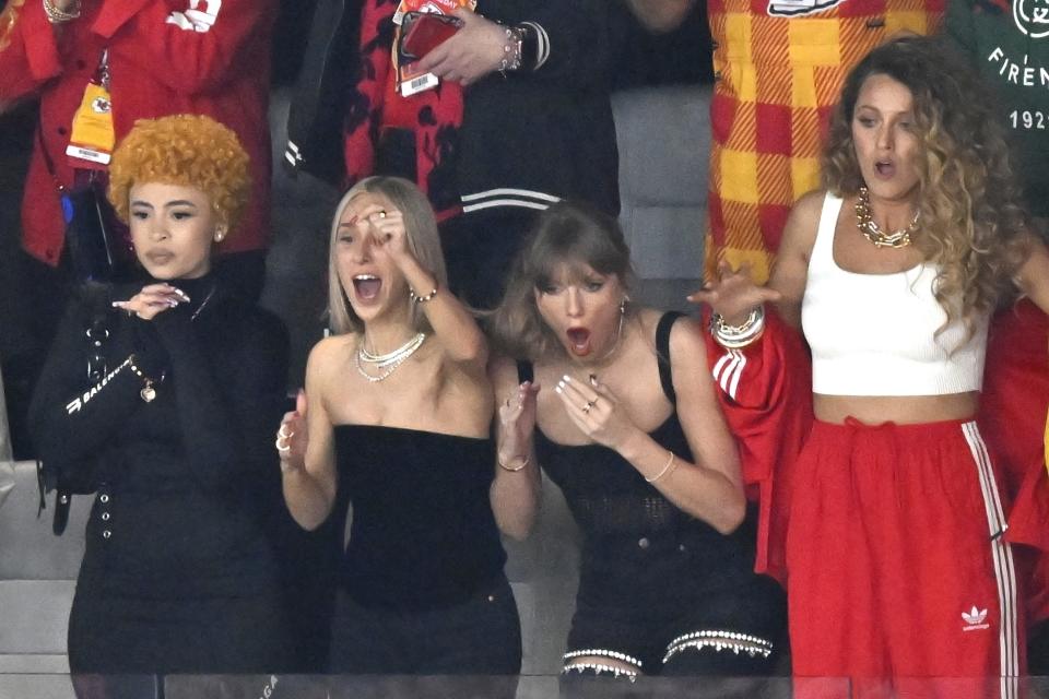 Ice Spice, from left, Ashley Avignone Taylor Swift and Blake Lively react during the first half of the NFL Super Bowl 58 football game between the San Francisco 49ers and the Kansas City Chiefs on Sunday, Feb. 11, 2024, in Las Vegas. (AP Photo/David Becker)