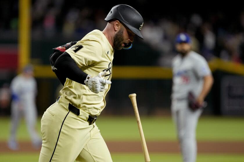 Arizona Diamondbacks Christian Walker runs after hitting his two run walk-off home run against the Los Angeles Dodgers during the 10th inning of a baseball game, Tuesday, April 30, 2024, in Phoenix. (AP Photo/Matt York)