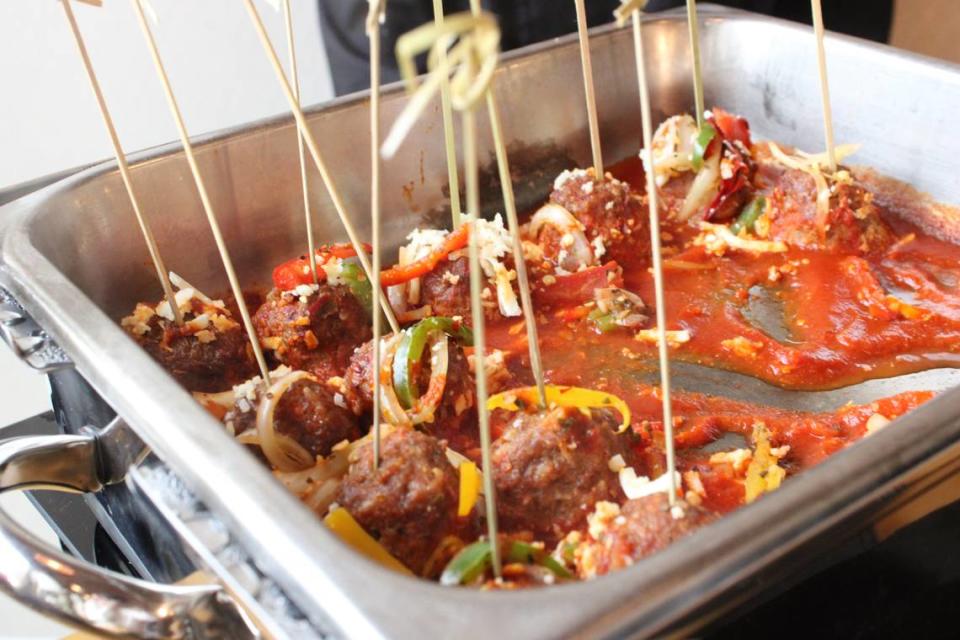 Albondingas, or meatballs, with chipotle pepper ranchera salsa, cojita, black beans, and rice at West + Stone, Sheraton’s new restaurant bar. Tuesday, April, 23, 2024. Ella Gonzales/egonzales@star-telegram.com