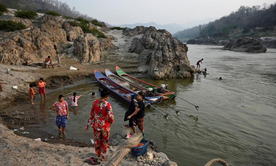 Villagers bathe on the Thai side of the Salween river