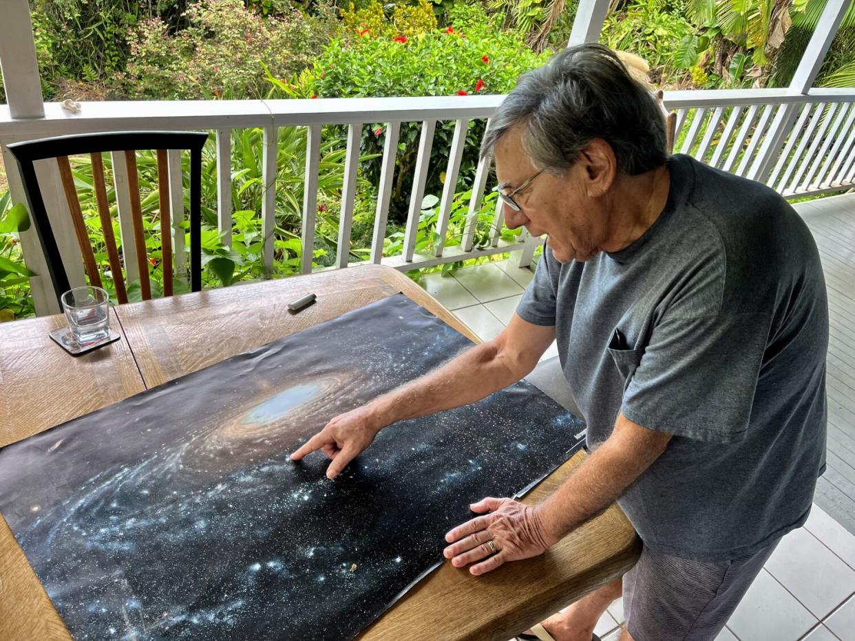 Jon Lomberg reviews a print of his Jon Lomberg reviews a print of his painting of the Milky Way