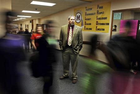 Jeff Bisek, superintendent of the Mahnomen School District, stands in a hallway at Mahnomen High School in Mahnomen, Minnesota September 26, 2013. REUTERS/Dan Koeck