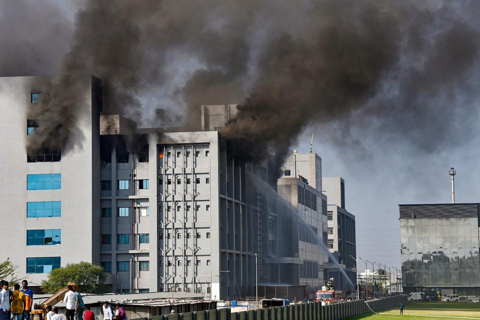 Smoke billows out after a massive fire broke out at the Serum Institute of India, in Pune, Thursday, 21 January 2021. The facility had rolled out its Covishield vaccine for the first phase of COVID vaccination drive that began on 16 January.