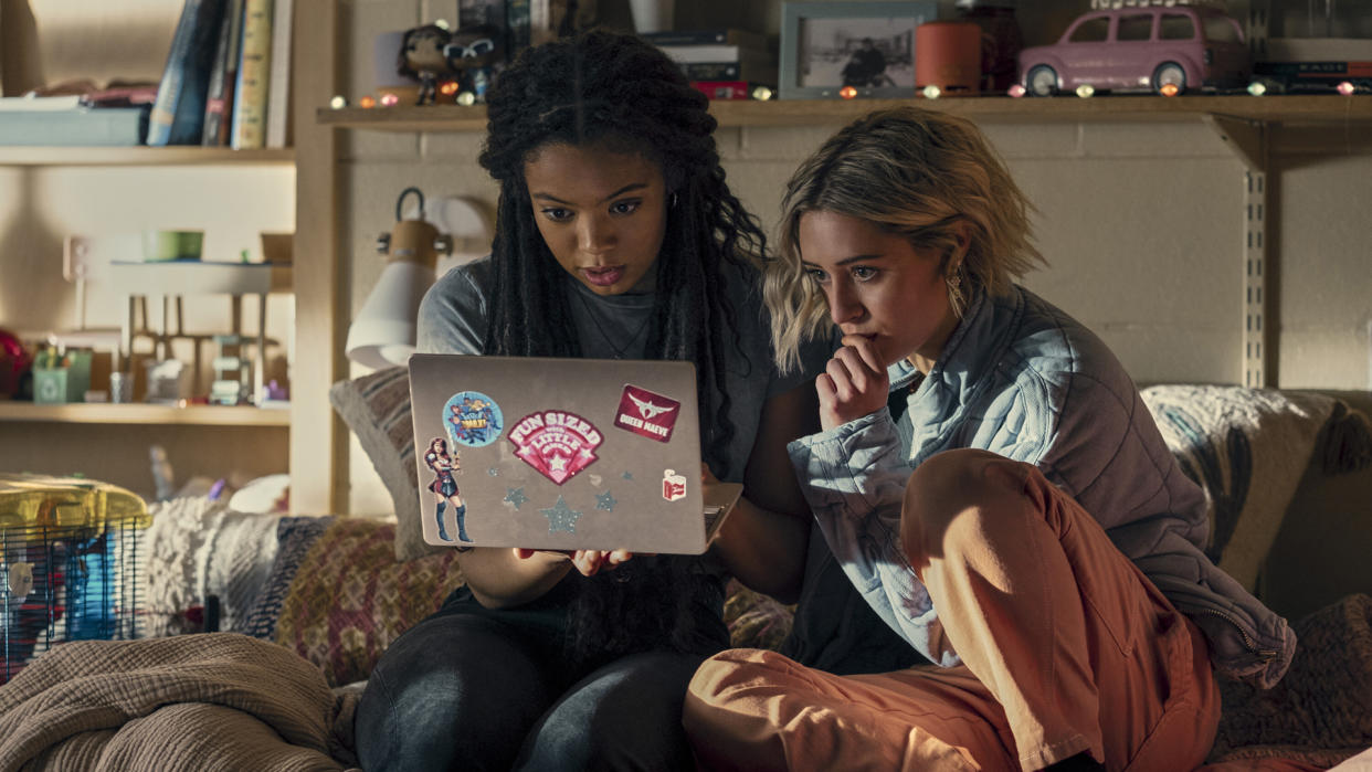  Marie and Emma stare at a laptop screen in The Boys spin-off show Gen V 