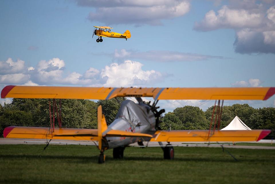 A Stearman biplane takes off from a runway during the 50th National Stearman Fly-In at the Galesburg Municipal Airport on Thursday, Sept. 9, 2021.