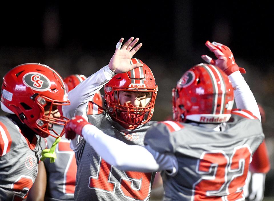 Canton South quarterback Poochie Snyder celebrates with wide receiver Tre Wilson after his second-quarter touchdown against West Branch last week.