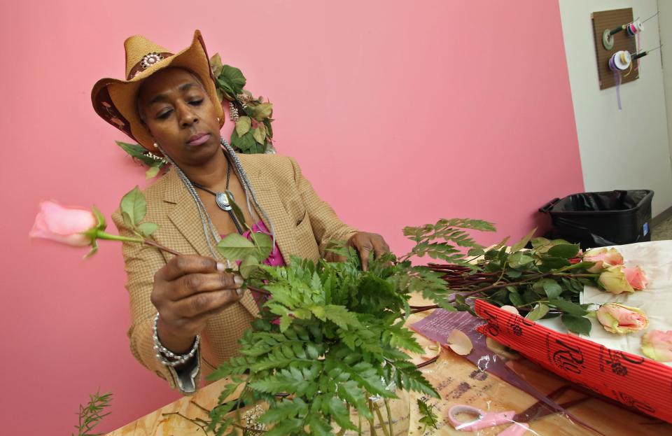 Owner Janie Williams puts a flower arrangement together at Williams Florist on Suttle Street in Shelby Monday afternoon, March 20, 2023.