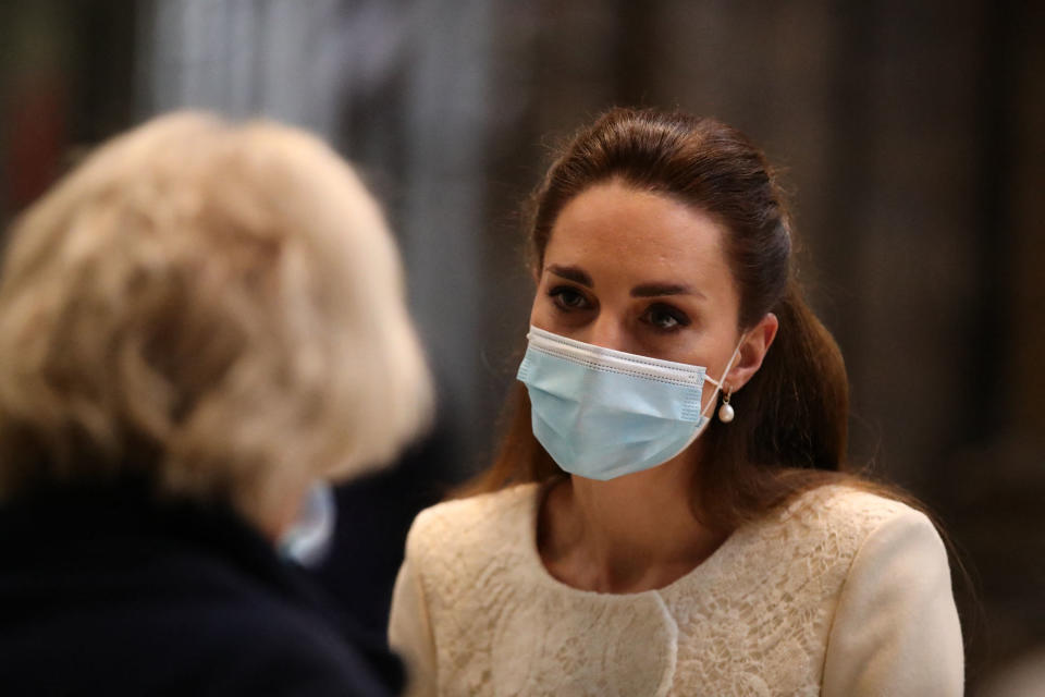 Britain's Catherine, Duchess of Cambridge (R) speaks to health workers as she visits the coronavirus vaccination centre at Westminster Abbey, central London on March 23, 2021, to pay tribute to the efforts of those involved in the Covid-19 vaccine rollout. (Photo by Aaron Chown / POOL / AFP) (Photo by AARON CHOWN/POOL/AFP via Getty Images)