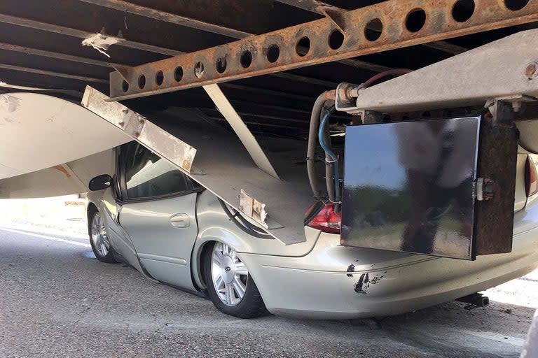 A 61-year-old has said he is grateful to be alive after the car he was driving was crushed when it slid under a lorry in the US. Fire officials say they are amazed Ricki Artruc was not seriously hurt after the car he was driving in Uxbridge, Massachusetts, hit a piece of concrete in the road and became airborne.The brakes didn't work and the car crossed a grassy area onto a highway ramp, where it became wedged under the tractor-trailer. The car was then dragged "a good distance" on Route 146 and the roof was crushed. A spokesman for Uxbridge Fire Department said Mr Artruc climbed out of the driver's side door. The 61-year-old driver, of Southbridge, told NBC Boston he's "just glad to be alive".He added: “When I hit [the piece of concrete], it just launched the car in the air. I did a Dukes of Hazzard.“I could see I was coming to the tractor-trailer and I knew I couldn’t stop. I had no brakes, nothing, I knew I was going to hit it.”Uxbridge Fire Department said Mr Artruc was taken to hospital and is recovering from minor injuries.