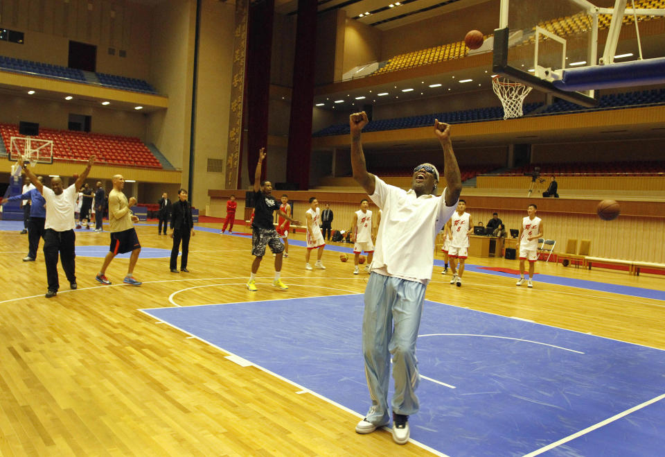 Dennis Rodman cheers after a fellow U.S. basketball player makes a jump shot during a practice session with North Korean players in Pyongyang, North Korea on Tuesday, Jan. 7, 2014. Rodman came to the North Korean capital with a squad of U.S. basketball stars for an exhibition game on Jan. 8, the birthday of North Korean leader Kim Jong Un. (AP Photo/Kim Kwang Hyon)