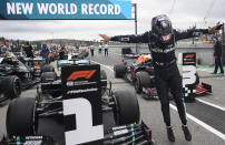 Mercedes driver Lewis Hamilton of Britain jumps out of his car after his record breaking win during the Formula One Portuguese Grand Prix at the Algarve International Circuit in Portimao, Portugal, Sunday, Oct. 25, 2020. (Jorge Guerrero, Pool via AP)