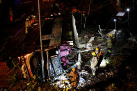 <p>Rescuers walk beside a crashed bus in Hong Kong, China, Feb. 10, 2018. (Photo: Bobby Yip/Reuters) </p>