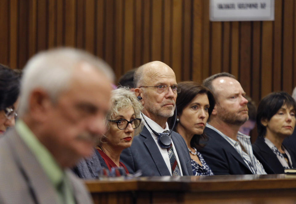 Aunt and uncle of Oscar Pistorius, Lois, second from left, and Arnold Pistorius, third from left, listen as Oscar Pistorius testifies in court in Pretoria, South Africa, Tuesday, April 8, 2014. Pistorius is charged with the murder of his girlfriend Reeva Steenkamp, on Valentines Day in 2013. (AP Photo/Kim Ludbrook, Pool)