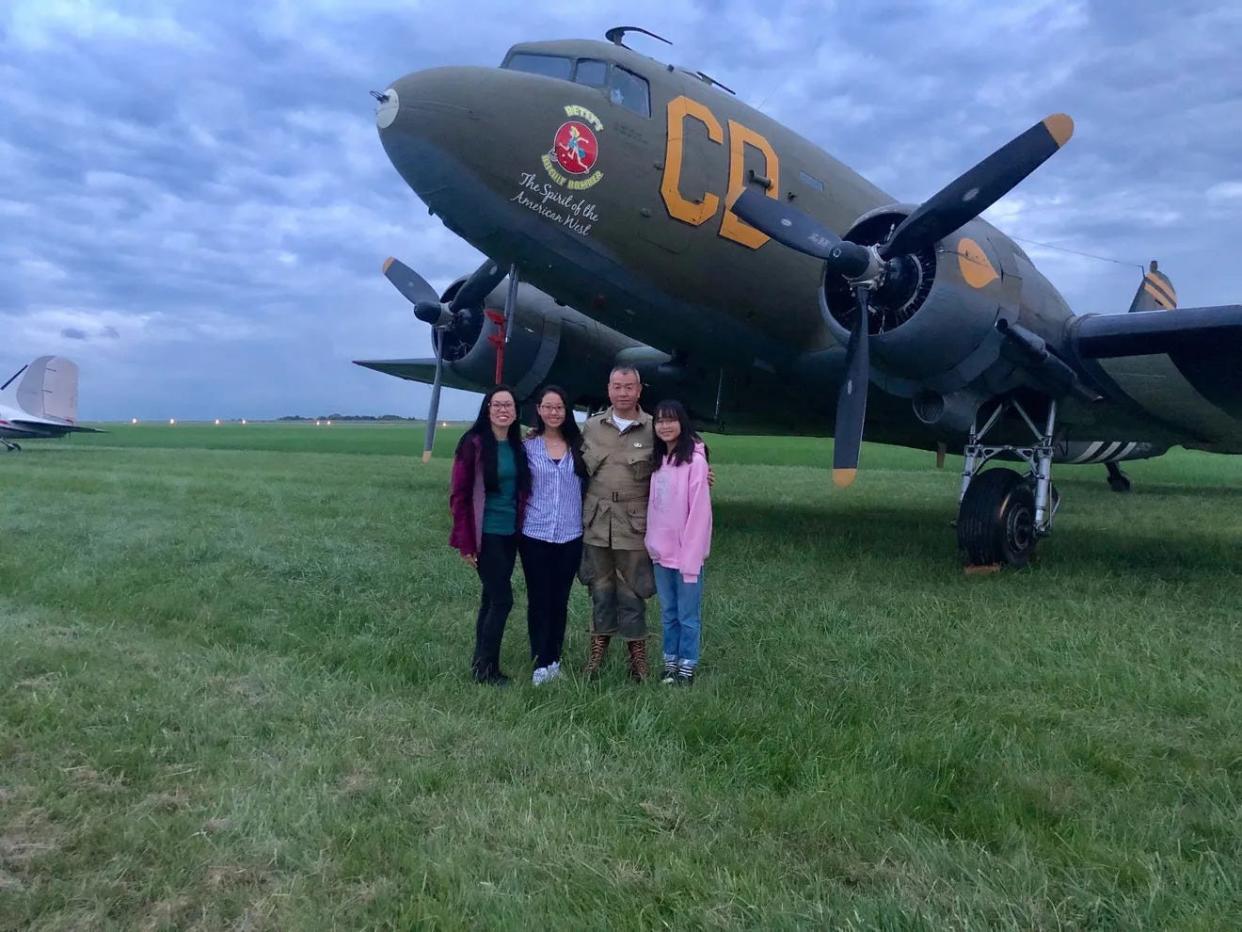 Chung Wong with his wife, Daisy, and two daughters who waited below in France after he parachuted from a plane on June 5, 2019, in Normandy for the 75th anniversary of D-Day.