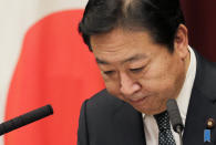 Japan's Prime Minister Yoshihiko Noda bows after a press conference at his official residence in Tokyo Friday, Nov. 16, 2012. Noda dissolved the lower house of parliament earlier in the day, paving the way for elections in which his ruling party will likely give way to a weak coalition government divided over how to solve Japan’s myriad problems. Elections were set for Dec. 16. (AP Photo/Koji Sasahara)