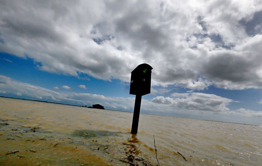 LEMOORE, CALIF. - MAR. 21, 2023. A mailbox stands in the floodwaters that have innundated farms near the community of Stratford. Recent heavy rains and snowmelt from surrounding mountains have swollen the rivers that flow into the vast and fertile San Joaquin Valley. Tulare Lake, a ghost lake that was drained more than 100 years ago, is slowly filling up and more flooding is expected with greater spring snowmelt. (Luis Sinco / Los Angeles Times)