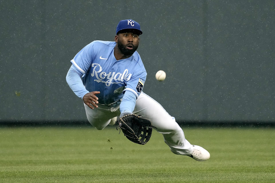 Kansas City Royals' Jackie Bradley Jr. catches a fly ball for the out on Chicago White Sox's Andrew Benintendi during the eighth inning of a baseball game Thursday, May 11, 2023, in Kansas City, Mo. The Royals won 4-3. (AP Photo/Charlie Riedel)