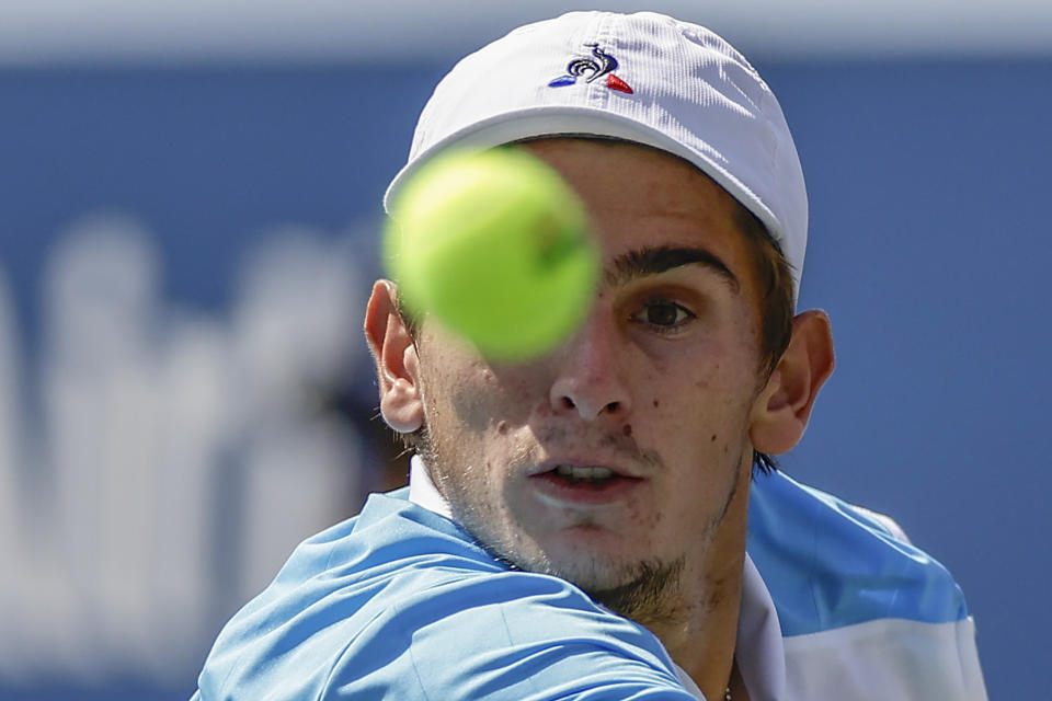 Matteo Arnaldi, of Italy, returns a shot to Cameron Norrie, of Great Britain, during the third round of the U.S. Open tennis championships, Saturday, Sept. 2, 2023, in New York. (AP Photo/Adam Hunger)