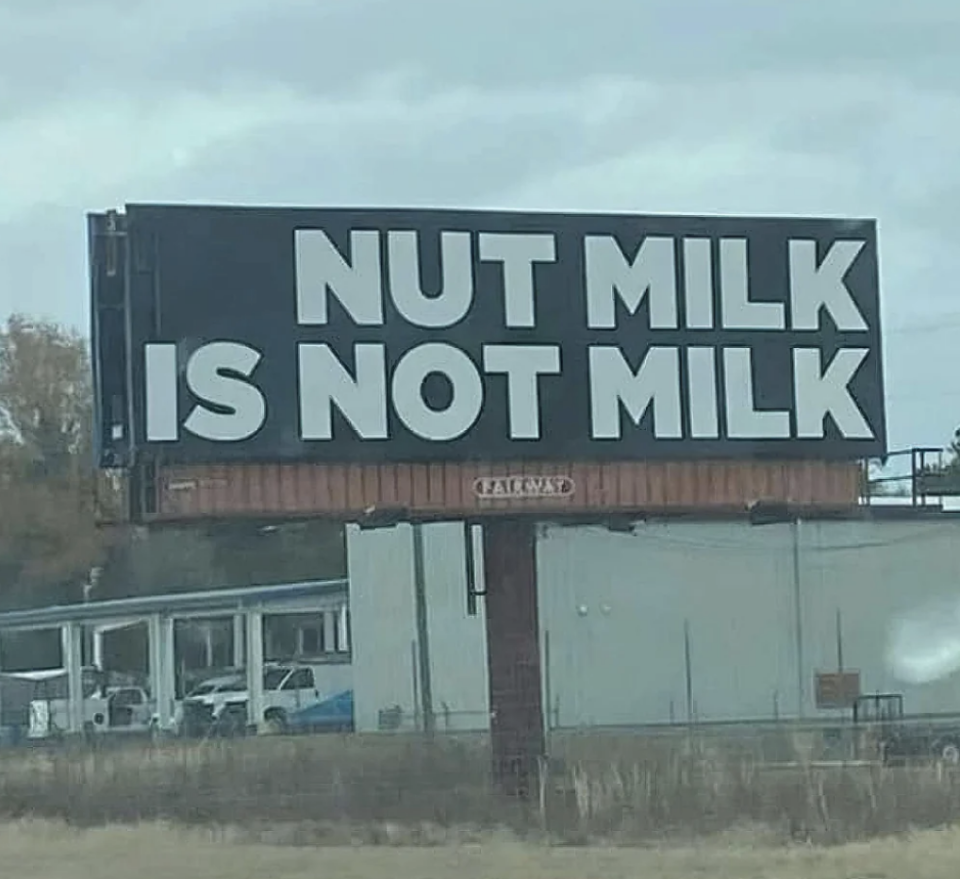 Billboard stating "NUT MILK IS NOT MILK" beside a road