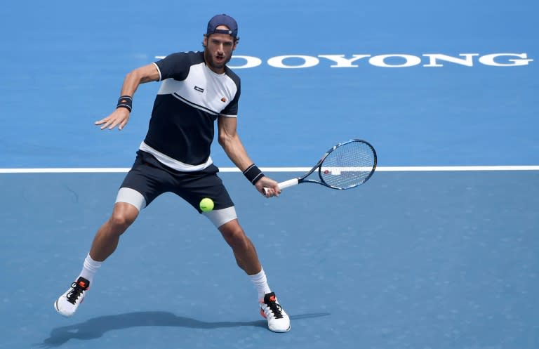 Feliciano Lopez of Spain hits a return against David Goffin of Belgium during the men's singles final of the Kooyong Classic, in Melbourne, on January 15, 2016