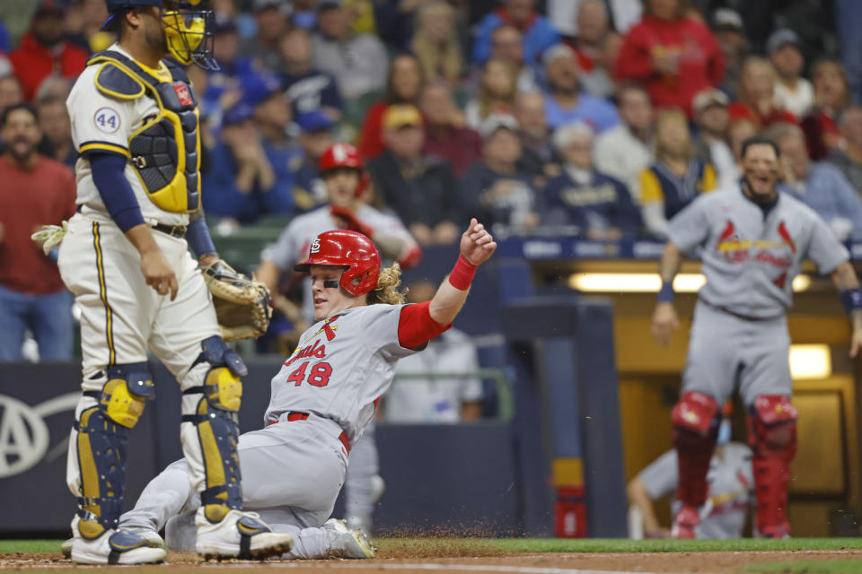 St. Louis Cardinals' Harrison Bader scores from second base on Cardinals' Tommy Edman fly out during the second inning of a baseball game against the Milwaukee Brewers Wednesday, Sept. 22, 2021, in Milwaukee. (AP Photo/Jeffrey Phelps)