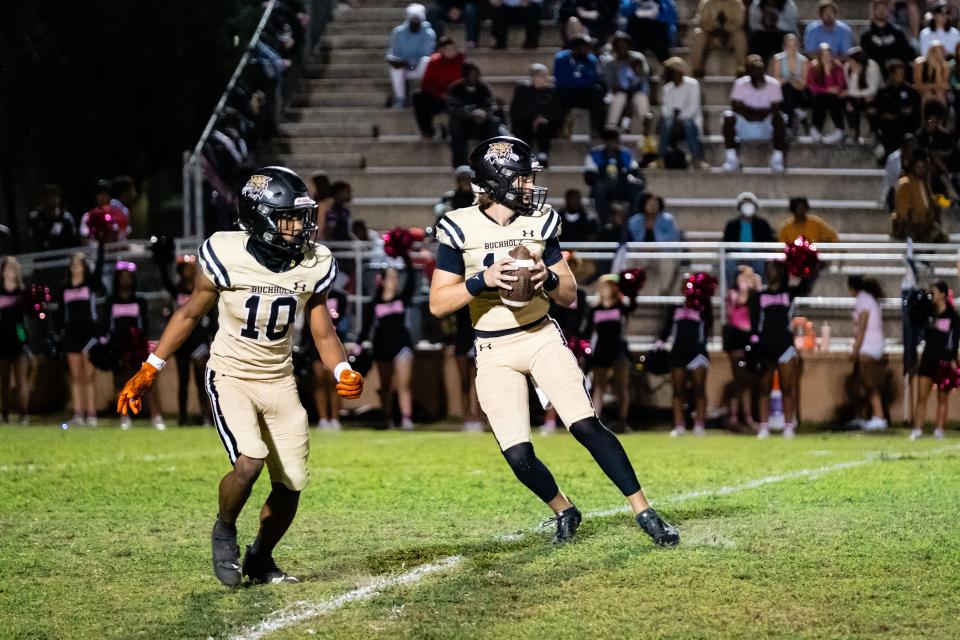 Buchholz Bobcats Trace Johnson (12) looks to throw during the first half against Bartram Trail at Citizens Field in Gainesville, FL on Thursday, October 19, 2023. [Chris Watkins/Gainesville Sun]