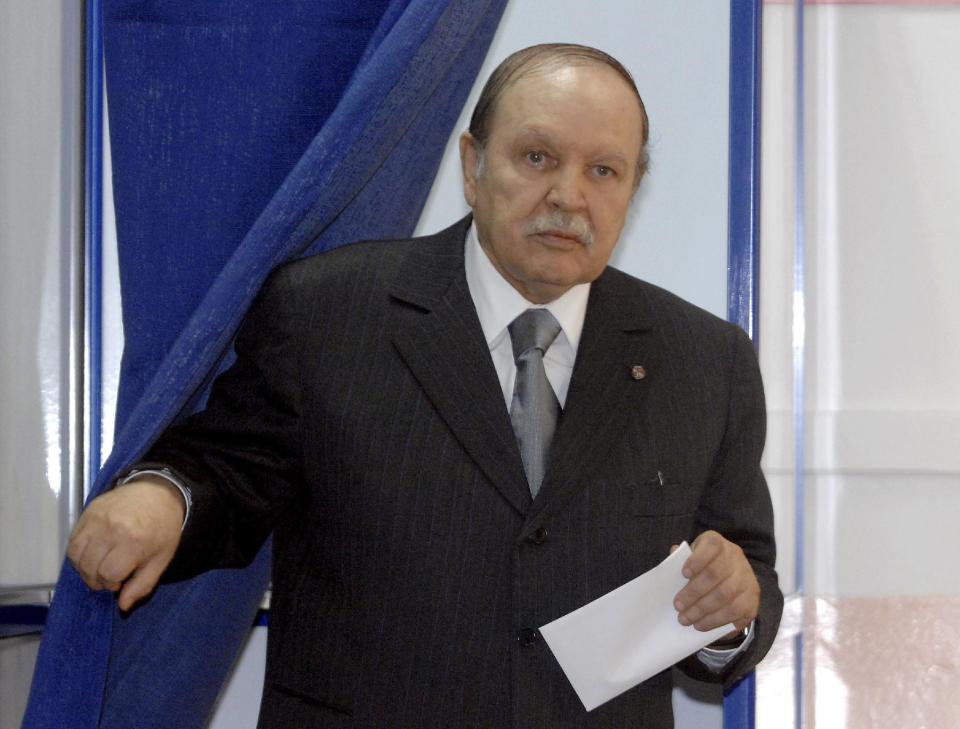 FILE - This May, 10, 2012 file photo shows Algerian President Abdelaziz Bouteflika exiting a parliamentary election voting booth in Algiers. Algeria's presidency says the country's ailing president has been in a Paris military hospital since Monday for a routine checkup and his condition is improving. Abdelaziz Bouteflika suffered a stroke in April and was hospitalized for four months in Paris' Val-de-Grace hospital. He has seemed visibly weak in rare television appearances since then. (AP Photo/Sidali Djarboub, File)