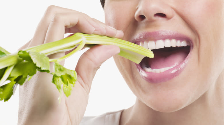 Person eating celery
