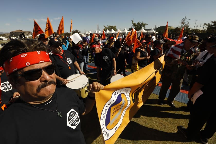 LOS ANGELES, CA - NOVEMBER 9, 2019 - - Eliseo Ligorea, left, with Los Angeles County Federation of Labor AFL-CIO, joins hundreds who attend the, "Rally for Justice Immigrant Rights and Equality - 25 years beyond Proposition 187," at the Los Angeles State Historic Park in Los Angeles on November 9, 2019. State Senator Maria Elena Durazo, U.S. Congresswoman Lucille Roybal Allard, Los Angeles Mayor Eric Garcetti, and many members of Los Angeles City Council spoke at the rally. Prop. 187 aimed to block undocumented immigrants from using non-emergency health care, public education and other services in the State of California. Federal courts denied it from ever being implemented. (Genaro Molina / Los Angeles Times)