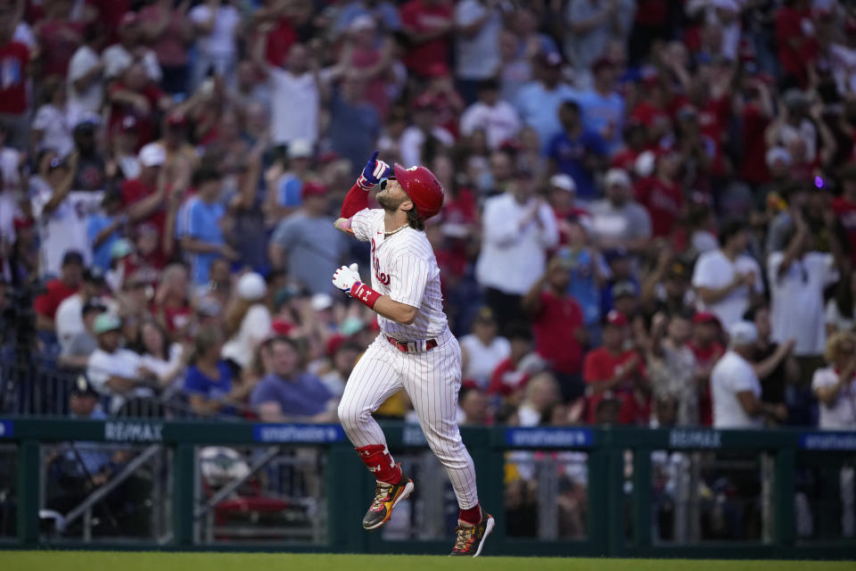 Philadelphia Phillies' Bryce Harper reacts after hitting a home run against San Diego Padres pitcher Ryan Weathers during the fourth inning of the second baseball game in a doubleheader, Saturday, July 15, 2023, in Philadelphia. (AP Photo/Matt Slocum)