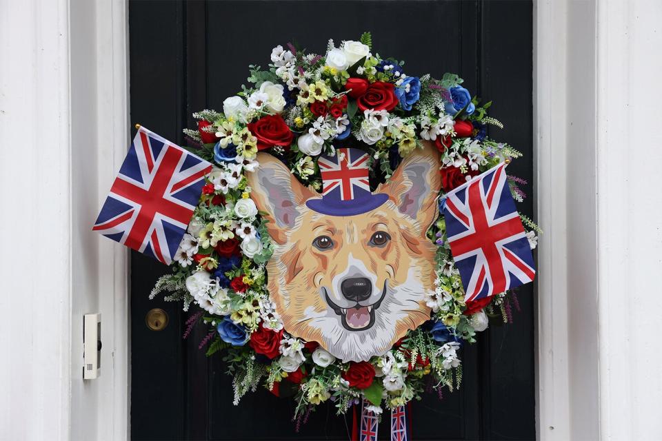 A wreath with British Union flags and a corgi image hangs on a door near Windsor castle during Platinum Jubilee celebrations in Windsor, UK, on Sunday, June 5, 2022. The Platinum Jubilee is a year of celebrations in the UK and Commonwealth countries to mark the 70th anniversary of the accession of Queen Elizabeth II on Feb. 6, 1952, which culminates with a four-day bank holiday weekend. Photographer: Hollie Adams/Bloomberg via Getty Images