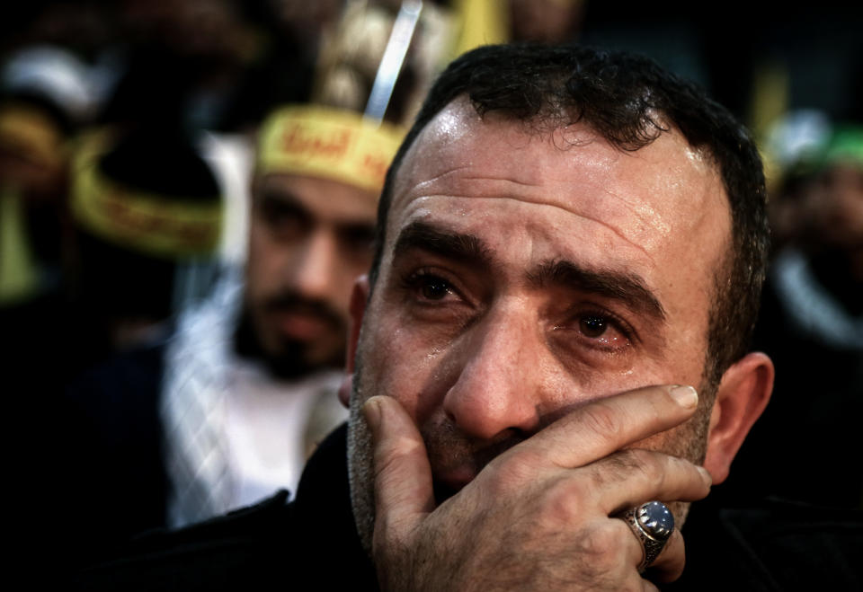 05 January 2020, Lebanon, Beirut: A supporter of Lebanon's Iran-allied Hezbollah movement, cries as he attends a mass rally and a televised speech by Hezbollah Secretary-General Hassan Nasrallah, in tribute to Qassem Soleimani, commander of the elite Quds Force of the Iranian Revolutionary Guard, and Abu Mahdi al-Muhandis, the deputy head of the predominantly Shia Muslim Popular Mobilization Forces (PMF), who were killed in a US airstrike in Baghdad. Photo: Marwan Naamani/dpa (Photo by Marwan Naamani/picture alliance via Getty Images)