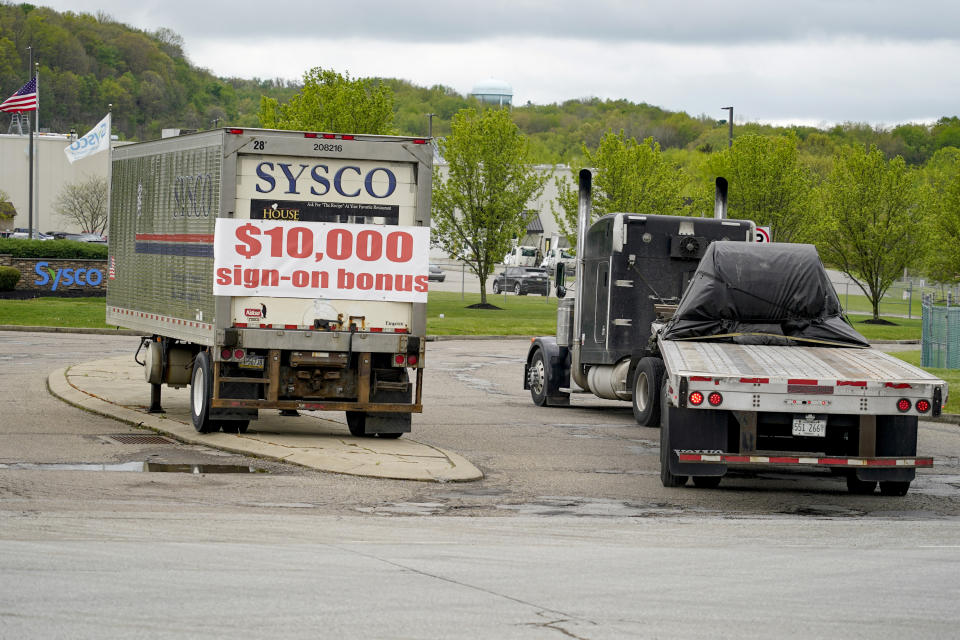 A tractor trailer rig pulls into a terminal for a trucking company that has a $10,000 hiring bonus offer posted on a trailer at their facility in Harmony, Pa., Wednesday, May 5, 2021. A bill by Pennsylvania's Republican-controlled Legislature to reinstate work-search requirements for people claiming unemployment benefits cleared the House Labor and Industry Committee on a party-line vote Tuesday. The sponsor, Rep. Jim Cox of Berks County, said many employers are having trouble finding workers. (AP Photo/Keith Srakocic)