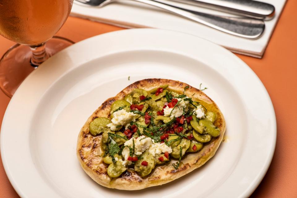 The bird is not the word: sides are the thing here, including the aubergine flatbread (Daniel Hambury/Stella Pictures Ltd)