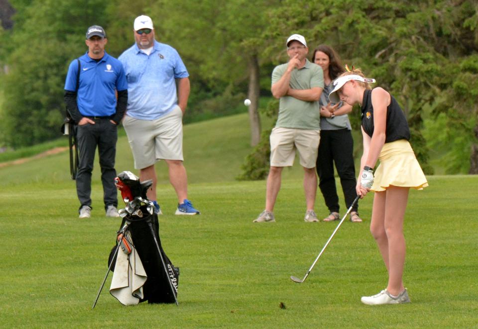 Mitchell's Allison Meyerink chips to the No. 18 green at the Brookings Country Club during the final round of the state Class AA girls golf tournament on Tuesday. Meyerink tied for third and led Mitchell to a runner-up finish in the team standings in the two-day tourney.