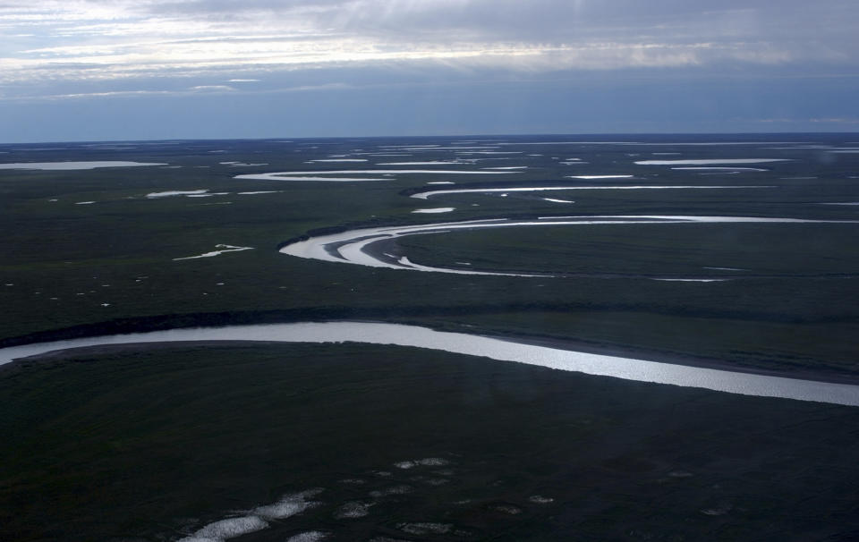 This July 8, 2004, photo provided by the United States Geological Survey shows Fish Creek through the National Petroleum Reserve-Alaska, managed by the Bureau of Land Management on Alaska's North Slope. (David W. Houseknecht/United States Geological Survey via AP)