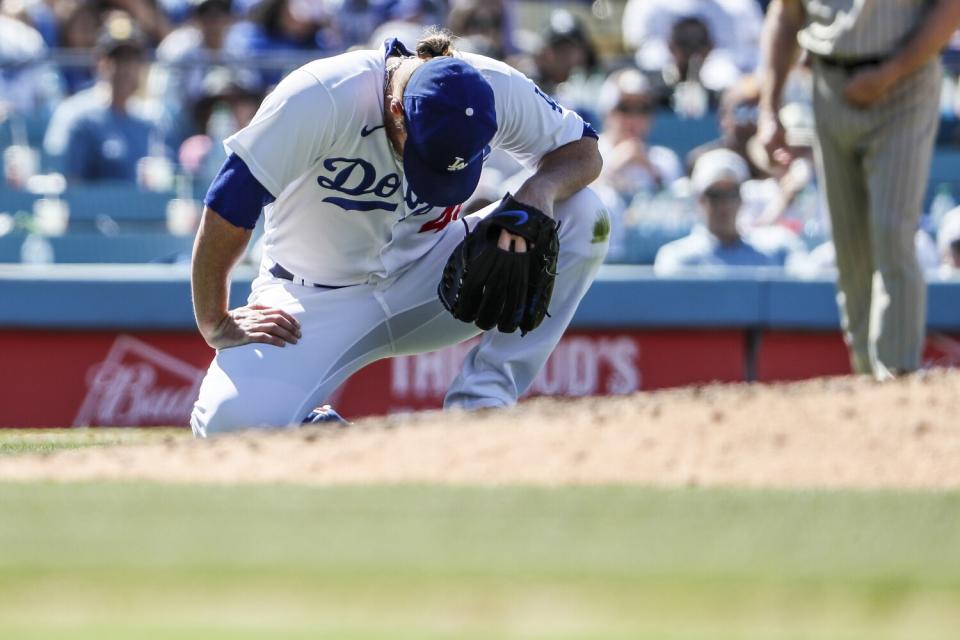 Dodgers relief pitcher Craig Kimbrel gathers his composure after being hit by a line drive.