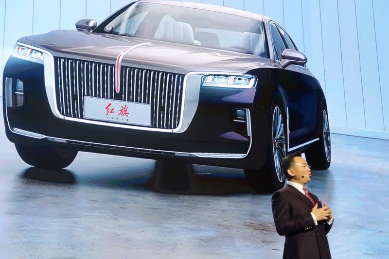 Xu Liuping, chairman of China's FAW Group, speaks at an event of Chinese car marque Hongqi, or Red Flag, held at the Great Hall of the People in Beijing