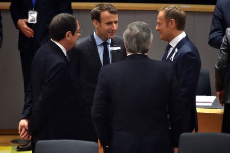 Cyprus President Nicos Anastasiades talks with French President Emmanuel Macron, European Council President Donald Tusk and European Parliament President Antonio Tajani as they attend a European Union leaders summit in Brussels, Belgium, March 22, 2018. REUTERS/Eric Vidal/Pool