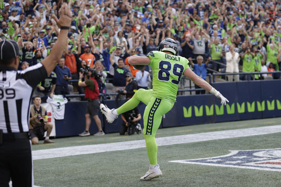 Seattle Seahawks tight end Will Dissly catches a pass for a touchdown against the Denver Broncos during the first half of an NFL football game, Monday, Sept. 12, 2022, in Seattle. (AP Photo/John Froschauer)