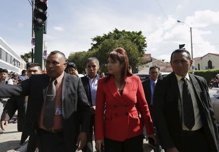Guatemalan Interior Minister Eunice Mendizabal (C), arrives to the crime scene where lawyer Francisco Palomo was shot dead in Guatemala City, June 3, 2015. REUTERS/Jorge Dan Lopez